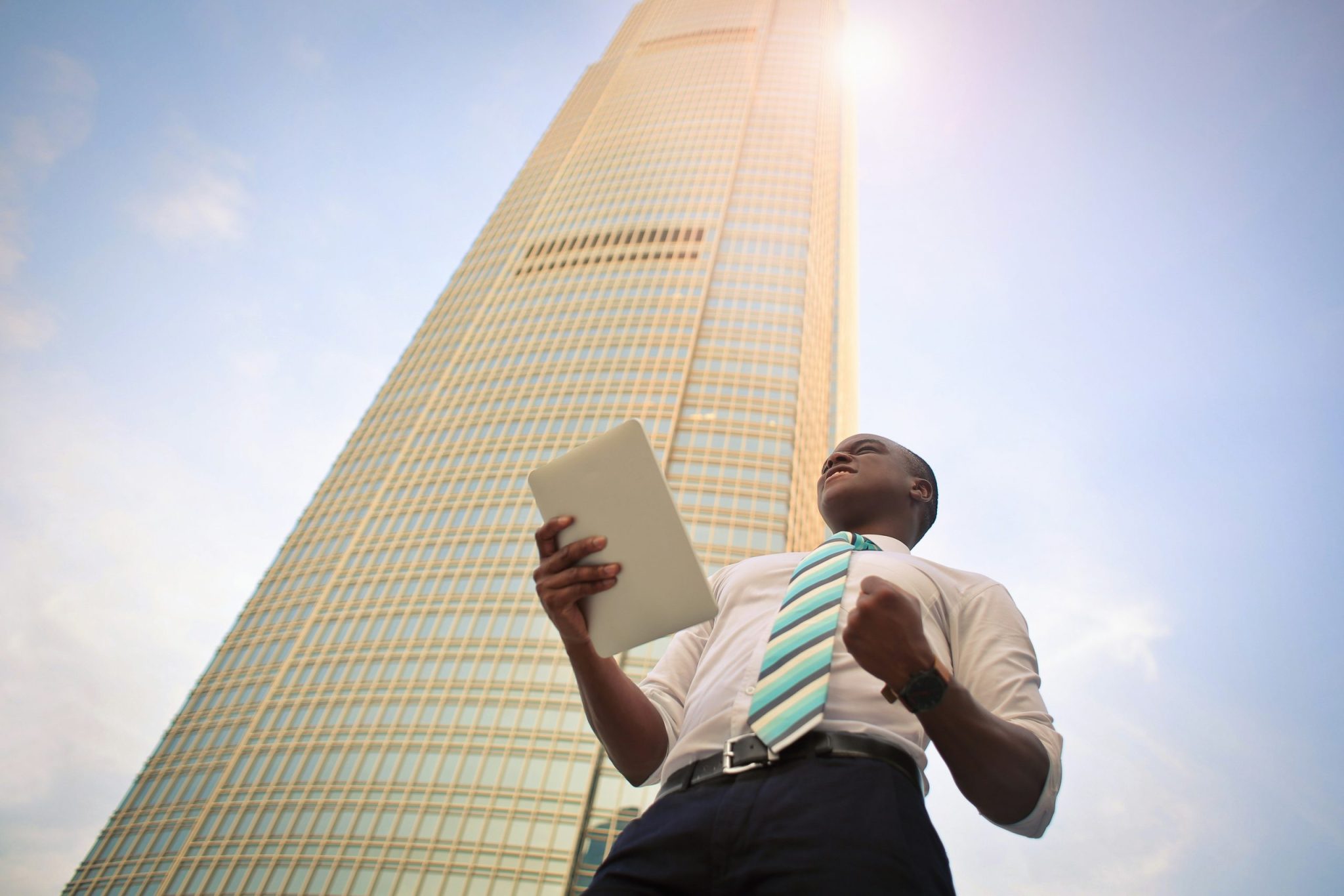 Man stands in front of a building